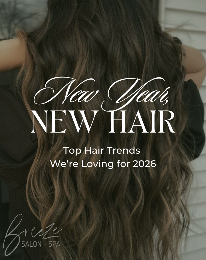 Person with long, wavy brown hair seen from behind; text overlay reads, "New Year, New Hair—Top Hair Trends We’re Loving for 2026. Breeze Salon + Spa.