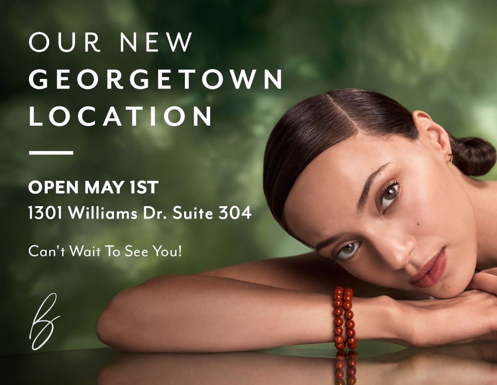 A woman rests her head on her arm with text announcing a new Georgetown Location opening May 1st at 1301 Williams Dr. Suite 304.