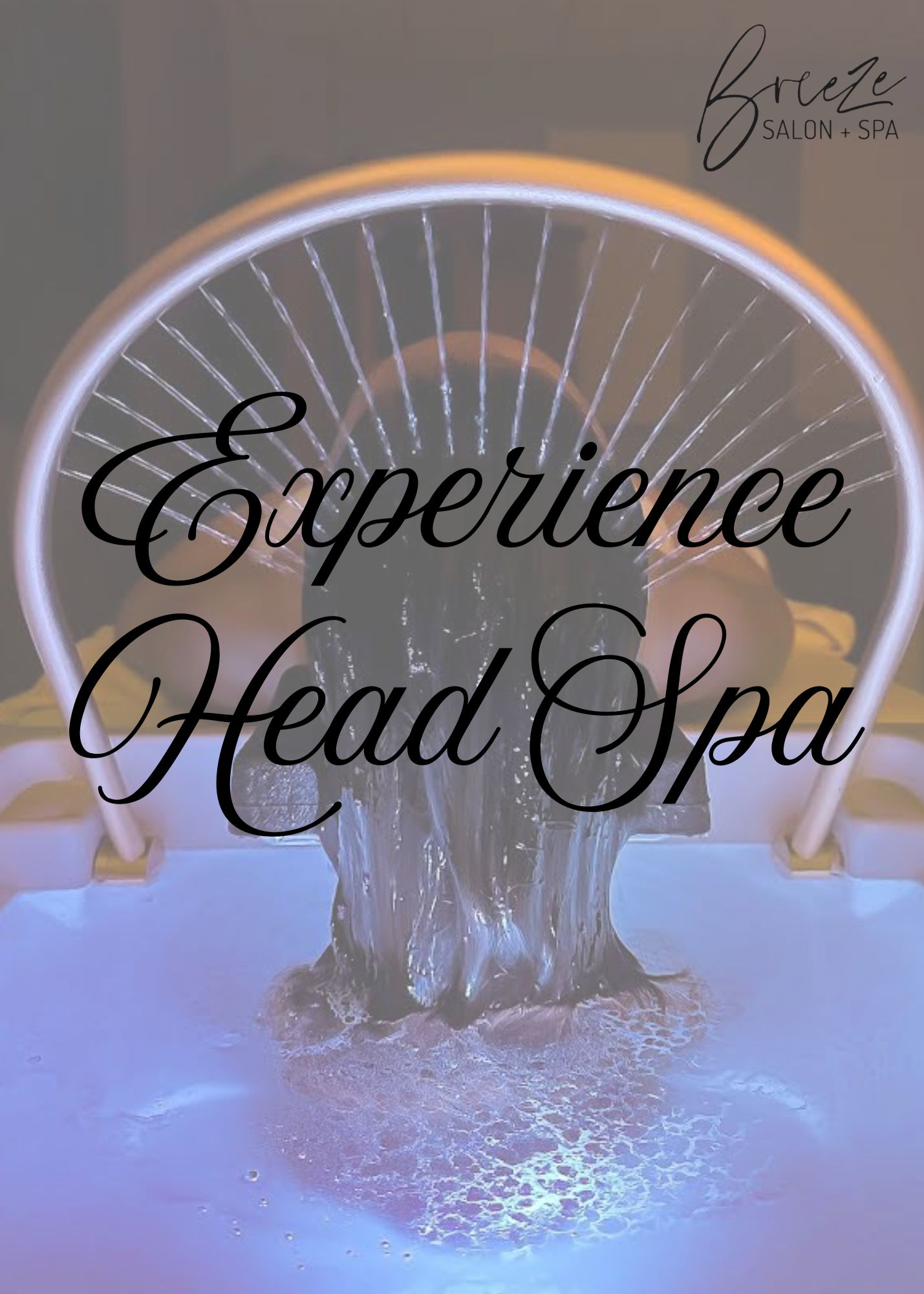 Person receiving a head spa treatment with water pouring over their head, under curved lighting, with "Experience Head Spa" text overlayed.